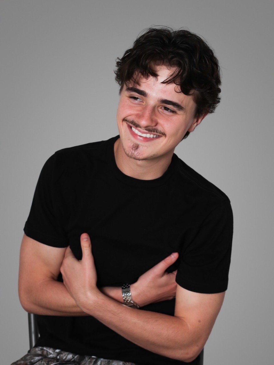 Ethan Jordan smiling in a black shirt